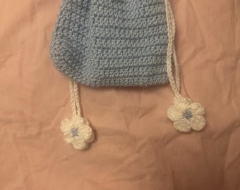 crochet baby blue pouch with flowers