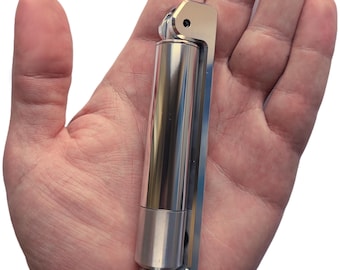 May include: A silver metal multi-tool with a folding design. The tool has a cylindrical body and a hinged section that folds out to reveal a variety of tools.