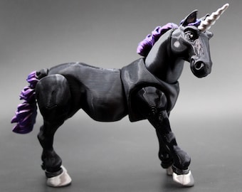 May include: A black unicorn figurine with a white horn and purple mane and tail. The unicorn has silver hooves and is posed on a gray surface. The figurine is a detailed, three-dimensional model.