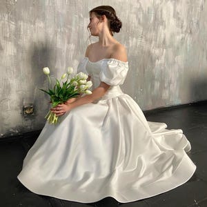 Simple corset basque waist wedding dress with sleeves