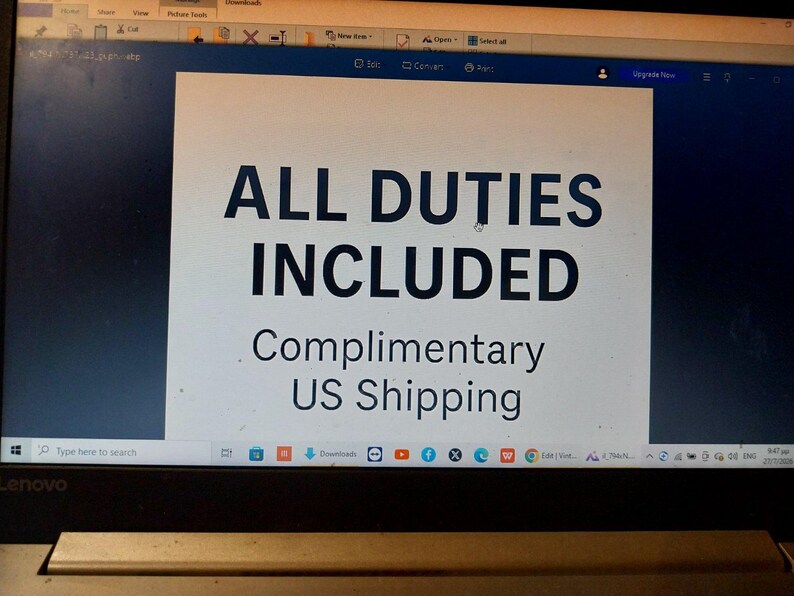 May include: A digital screen displaying a white rectangular graphic with dark blue text. The text reads ALL DUTIES INCLUDED in large capital letters, followed by the smaller text Complimentary US Shipping centered below the main heading.
