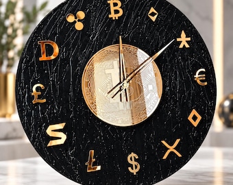 May include: A circular wall clock with a textured black face featuring gold-colored cryptocurrency and currency symbols as hour markers. The center displays a metallic gold Bitcoin emblem with thin gold clock hands indicating the time.