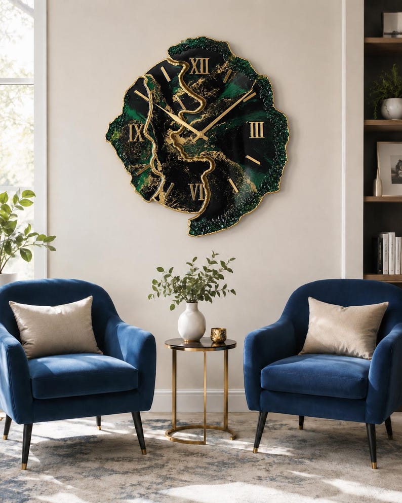 May include: A large, irregular, geode-style wall clock featuring a deep black and emerald green resin surface with gold-colored veins and accents. The clock face displays gold Roman numerals and thin gold hands, with a textured, crystalline edge.