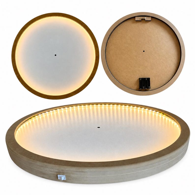 May include: A circular light fixture with a wooden frame and a white center panel. The light features an integrated LED strip that emits a warm glow. The back of the fixture includes a battery compartment and a metal mounting bracket for wall hanging.
