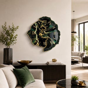 May include: A wall clock with an irregular, organic shape featuring a deep emerald green and black marbled surface with gold-colored accents. The clock face displays gold Roman numerals and thin gold hands, creating a striking contrast.