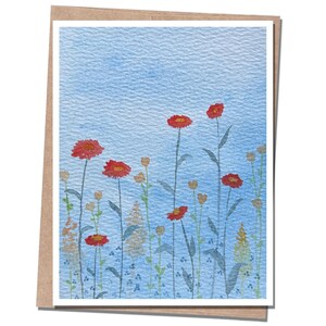 May include: Watercolor greeting card featuring a field of red flowers with green stems against a light blue background. The card is set in a white frame with a brown border.