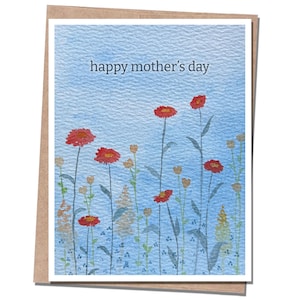 May include: A watercolor Mother's Day card with a blue background and the words "happy mother's day." The card features red flowers with green stems and leaves. The card is set in a brown paper envelope.
