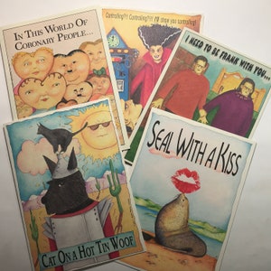 May include: Set of 5 humorous greeting cards featuring colorful illustrations and witty text. The cards include a cat in a tin man suit, a seal with a kiss, a sun with sunglasses, and people with hearts for heads. The text on the cards includes "In this world of coronary people...", "Controlling?!! Controlling?!!!!! I'll show you controlling!", "I need to be frank with you...", "Cat on a hot tin woof", and "Seal with a kiss".