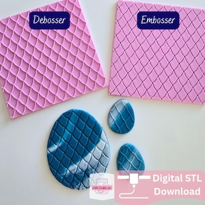 May include: Two square pink silicone mats with a raised fish scale pattern, labeled Debosser and Embosser. Below are three blue and white marbled oval shapes featuring the same scale texture. Includes a Little Cookie Jar logo and Digital STL Download text.