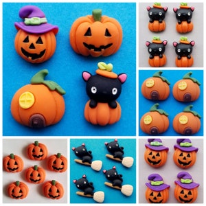 May include: A selection of Halloween decorations featuring pumpkins, black cats and witches. The pumpkins are orange with carved faces and some have a small house on the side. The black cats are wearing witch hats and riding brooms. The witches are wearing purple hats and have orange faces.