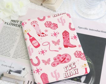 May include: A white rectangular case with a pink cowboy-themed pattern. The design includes cowboy boots, hats, dice, butterflies, and the words "Yee Haw".