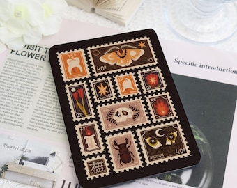 May include: Black rectangular case featuring a collage of vintage-style postage stamps with various illustrations, including a moth, skull, and flowers. The stamps have a dark brown border and are arranged in a grid pattern. The text "antique dolce 2822" is visible.