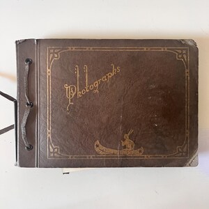 1930s & 40s family photo album with only a photos are missing; kids, babies, American flag, dolls, dogs, photo both photos. just beautiful.