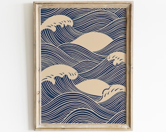 May include: A framed wall art print featuring a repeating pattern of stylized ocean waves. The design consists of dark navy blue flowing lines against a cream background, with solid cream-colored wave crests interspersed throughout the composition.