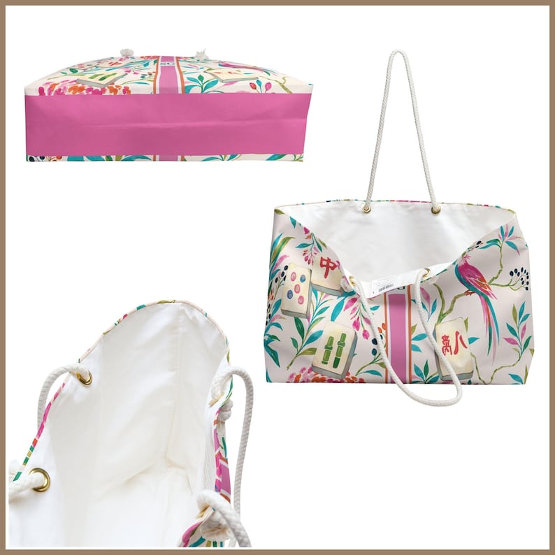May include: A tote bag featuring a white background with a colorful pattern of mahjong tiles, tropical birds, and foliage. The bag has a wide pink vertical stripe down the center, white rope handles, and a solid pink base panel on the bottom view.