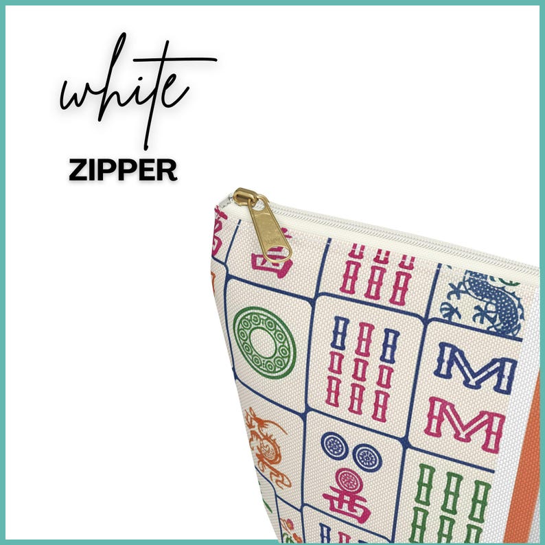 May include: A white zippered pouch with a gold zip pull. The pouch features colourful Mahjong tile designs. The word "white" is written in cursive above the word "ZIPPER".