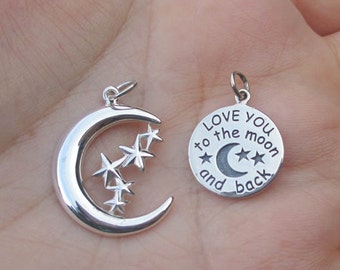May include: Two silver charm pendants. One is a crescent moon with three stars. The other is a round charm with the text "Love you to the moon and back" and a crescent moon with three stars.