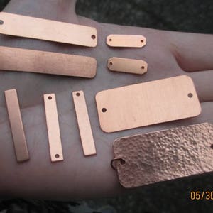 May include: Assortment of copper metal tags in various shapes and sizes. Some tags have a hammered texture, while others are smooth. The tags are perfect for adding a personalised touch to crafts, gifts, and home decor.