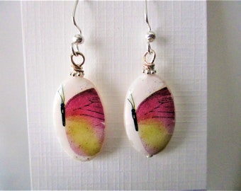 Butterfly on Oval Mother of Pearl shell base earrings. New. Handmade.