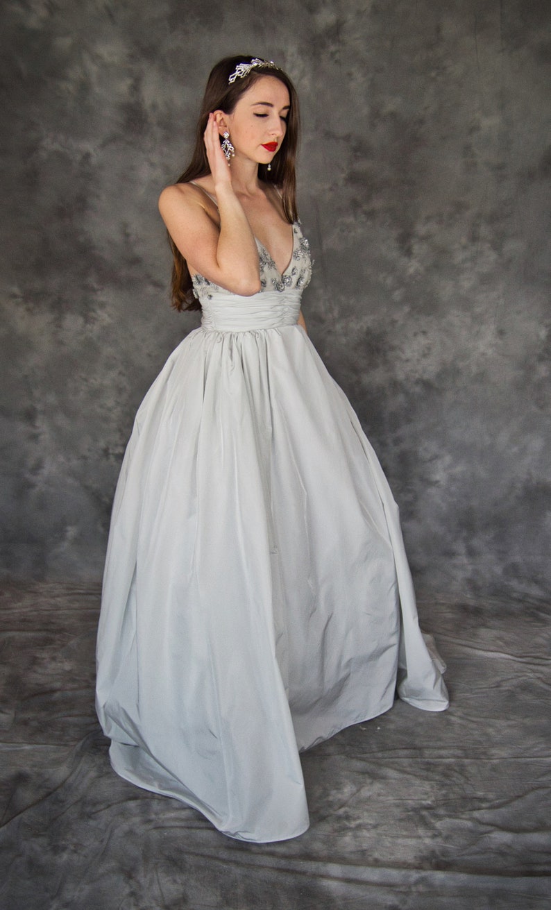 silver ball gown with sleeves