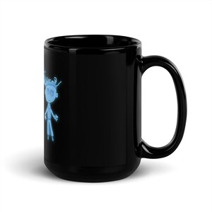 May include: A black ceramic mug with a white cartoon character design. The character has blue hair and is wearing a white shirt and blue pants.