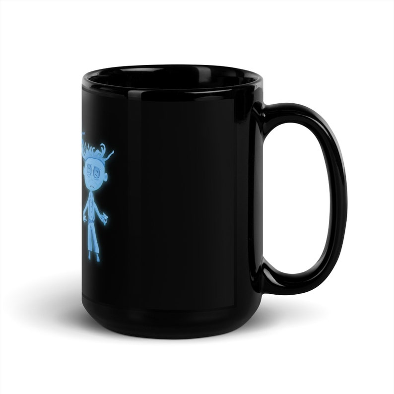 May include: A black ceramic mug with a white cartoon character design. The character has blue hair and is wearing a white shirt and blue pants.