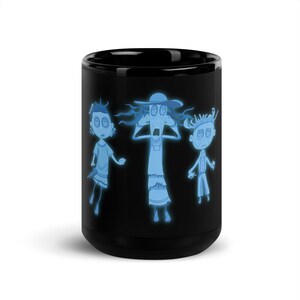 May include: Black coffee mug with a glow-in-the-dark design featuring three cartoon characters with button eyes. The characters are a woman with a hat, a girl, and a boy. The characters are all wearing white clothing and have blue skin.