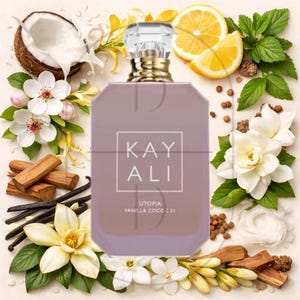 May include: A perfume bottle with a clear, faceted cap and a light purple body. The bottle is surrounded by ingredients like coconut, flowers, lemon slices, and vanilla beans. The text "KAY ALI UTOPIA VANILLA COCO | 21" is displayed on the bottle.