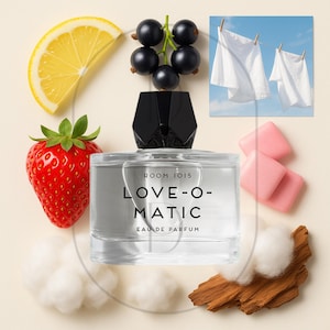May include: A perfume bottle with the text "LOVE-O-MATIC" is surrounded by a lemon slice, a strawberry, black currants, cotton, wood, and pink gum. Two white shirts hang on a clothesline against a blue sky.
