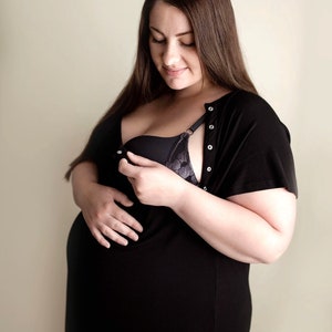 Plus Size pregnant mom wearing black hospital delivery gown to deliver baby. Fabric is soft and stretch with snaps at shoulder for breastfeeding and down back for epidural. Long enough to cover knees. Favorite baby shower gift from sister-in-law.