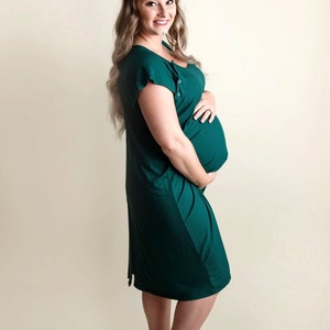 Plus Size pregnant mom wearing emerald green hospital delivery gown to deliver baby. Fabric is soft and stretch with snaps at shoulder for breastfeeding and down back for epidural. Long enough to cover knees. Favorite baby shower gift from sister.