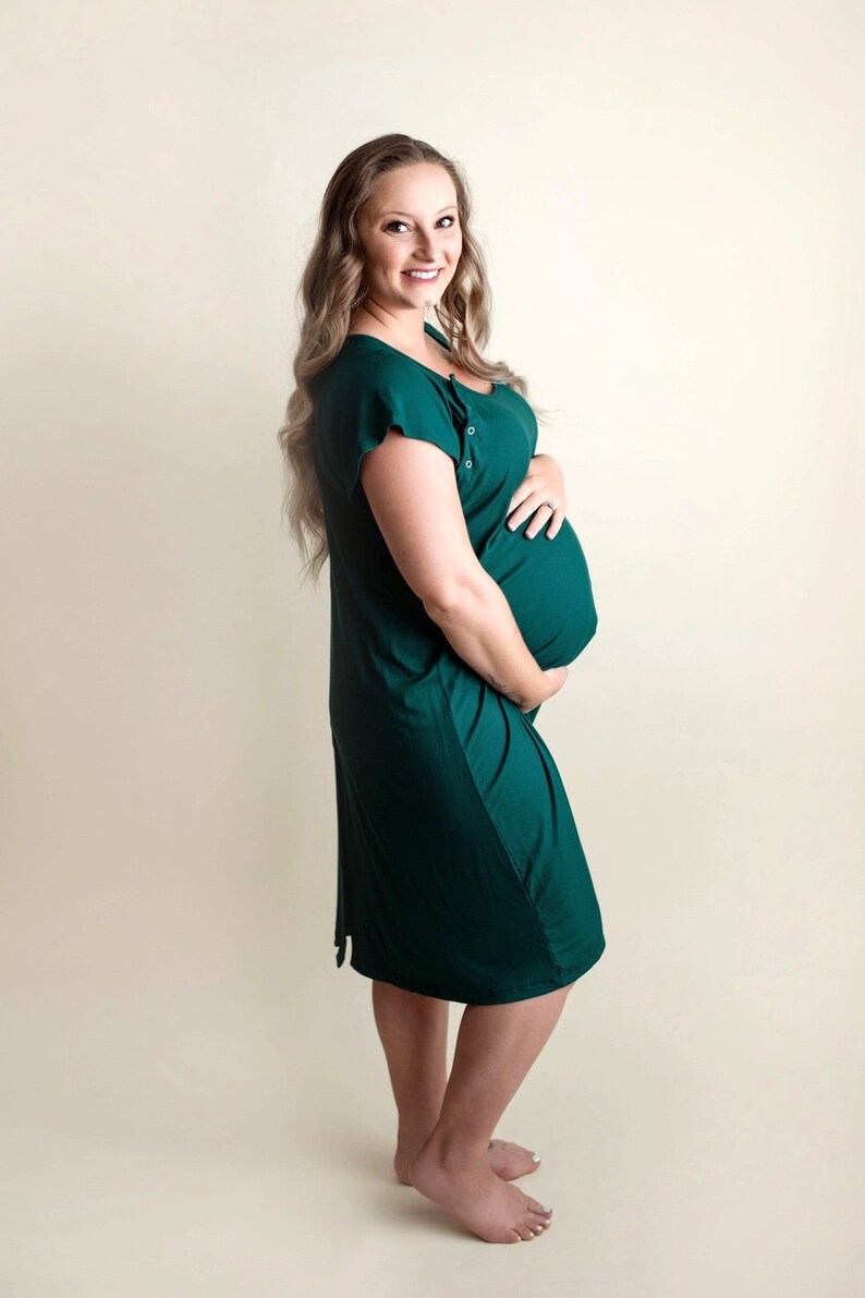 Plus Size pregnant mom wearing emerald green hospital delivery gown to deliver baby. Fabric is soft and stretch with snaps at shoulder for breastfeeding and down back for epidural. Long enough to cover knees. Favorite baby shower gift from sister.