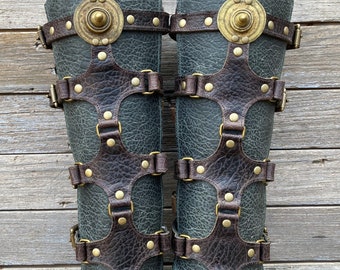 Dark Brown and Gray Green Distressed Leather Shin Guards, Gaiters with Antiqued Brass Hardware and Primitive Ethiopian Shield