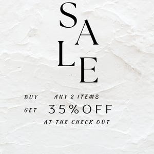 May include: White textured background with the word "SALE" in large black letters. Below, the text reads "BUY ANY 2 ITEMS GET 35% OFF AT THE CHECK OUT". The image is a promotional announcement.