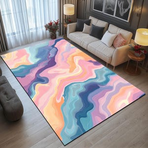 Pode incluir: Tapete de área abstrato com um padrão de redemoinho colorido em tons de rosa, azul, roxo e laranja.