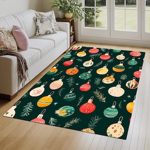 May include: A green rug with a Christmas ornament pattern. The ornaments are red, yellow, green, white, and orange. The ornaments are surrounded by green pine branches.