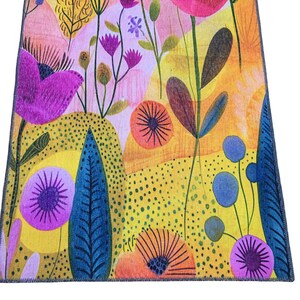 The image is a vibrant and colorful abstract pattern featuring various flowers, leaves, and other natural elements in a variety of bright colors, including shades of pink, orange, yellow, and blue.