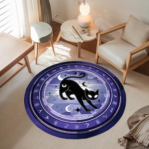 May include: A round purple and blue rug with a black cat silhouette in the center. The cat is surrounded by a circle of stars and moons. The rug has a geometric pattern around the edge.