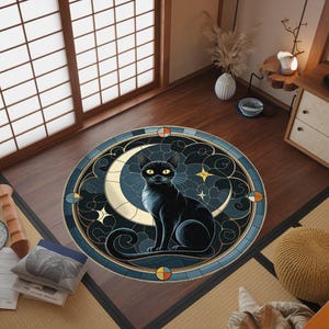 May include: A round rug with a black cat sitting on a crescent moon. The rug has a stained glass design with blue, gold, and white colors. The cat has yellow eyes and is looking to the right.