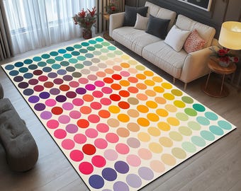 May include: A colorful round rug with a white background and a pattern of multi-colored circles. The circles are arranged in rows and columns, and they gradually transition from dark blue to light blue.