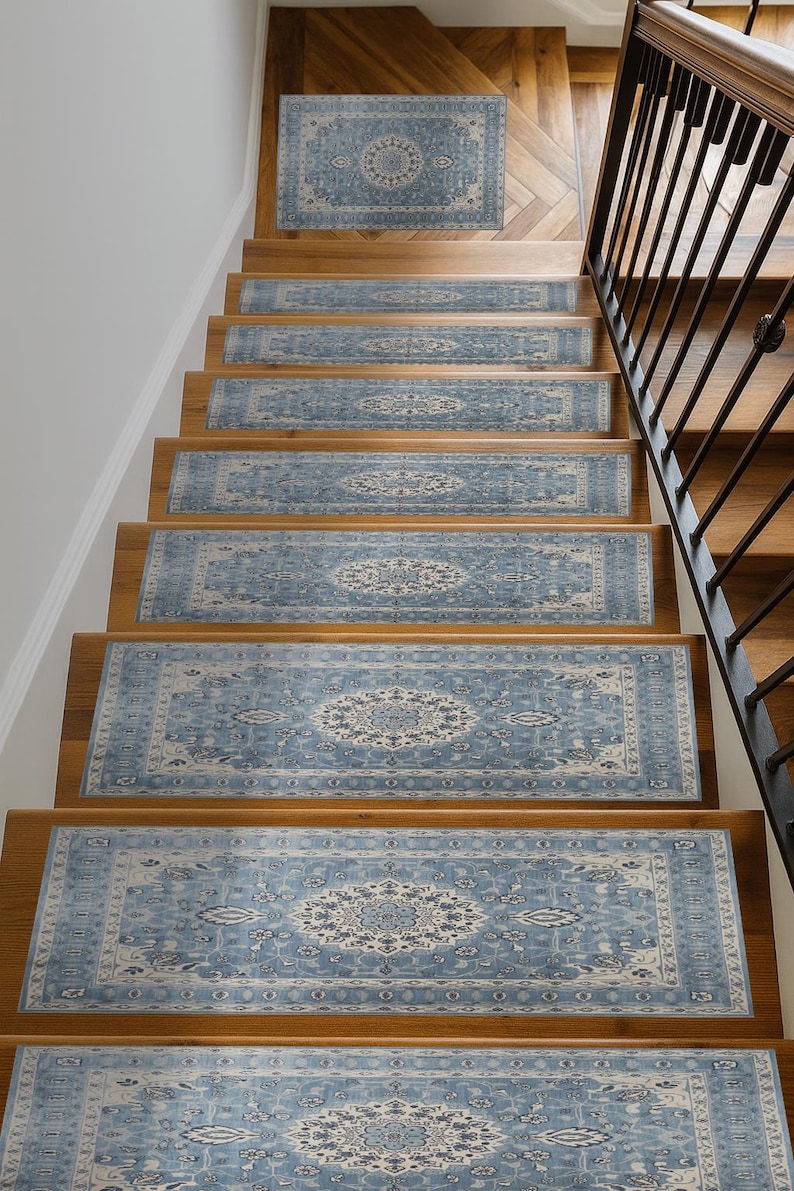A set of wooden stairs with blue and white patterned rugs on the steps leading up to a staircase.