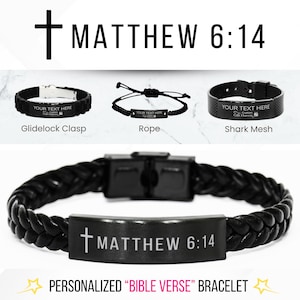 May include: Black leather bracelet with a silver clasp and a black metal plate engraved with the text "†MATTHEW 6:14".