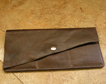 Brown leather wallet, oil tan distressed pull-up leather, 7 3/8" x 4", flap with snap, slots for 3 credit cards, 1 cash pocket