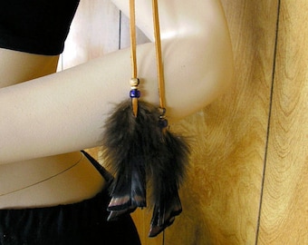 Honey leather and wild turkey feather arm band, made with deerskin leather with blue trade beads