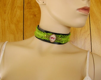 Mask cameo garter choker, lime green ribbon and black leather choker, glass and brass charm with brass brads, 1 1/4" wide, with leather ties