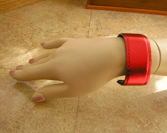 Metallic Red Leather Cuff Bracelet with black lining and stitching, 8"  x 1 1/4" wide, lined with soft black lambskin leather