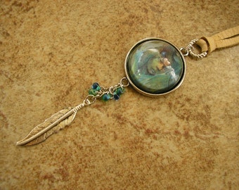 Shaman glass pendant necklace, glass cabochon charm set in a silver frame, with feather charm, on a 28" cream leather cord, pendant is 1"