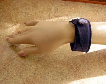 Purple Leather Cuff Bracelet, with purple glass mandala charm, black lining and stitching, 8"  x 1 1/4" wide