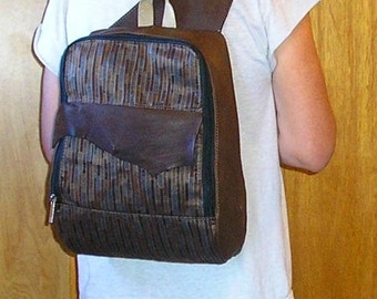 Large Leather and fabric Backpack, 10" x 15" x 6", Coco deerskin and brown upholstery fabric with a cross-body strap and zippered pockets