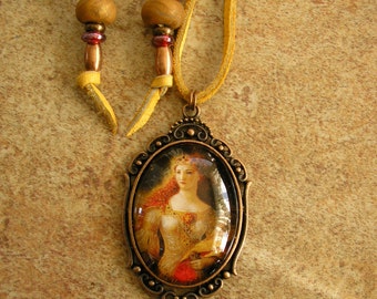 Queen, 30 mm x 40 mm glass dome pendant in a brass frame with a 32" adjustable gold deerskin leather cord, with trade beads